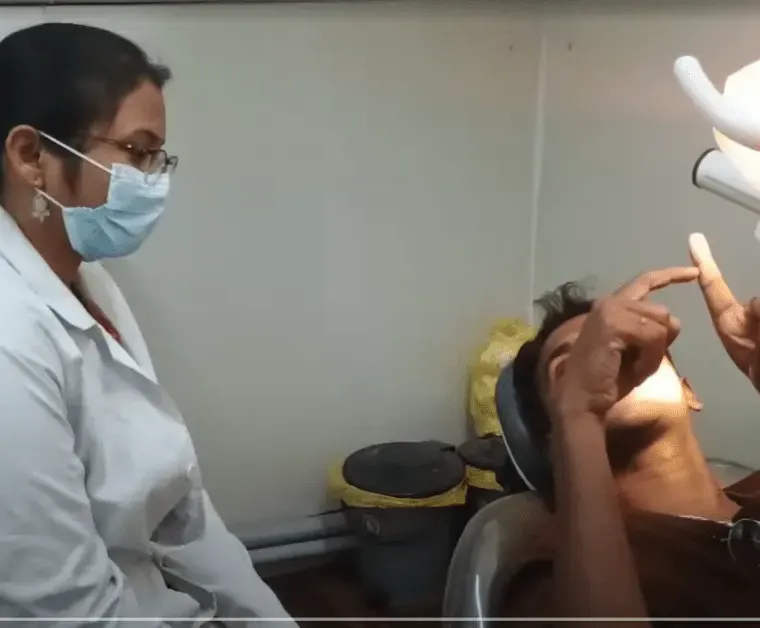 Patient consulting with a dentist about root canal treatment at Dentick Dental Care.