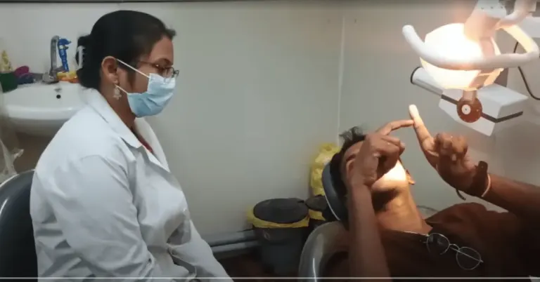 Patient consulting with a dentist about root canal treatment at Dentick Dental Care.